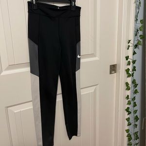 Black, grey, and white Nike dri-fit leggings